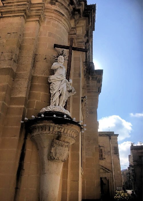 A statue of Christ holding His cross in Rabat, Malta.