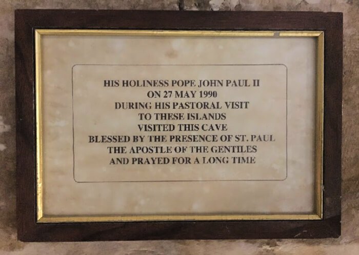Pope St. John Paul II praying in St. Paul's grotto.